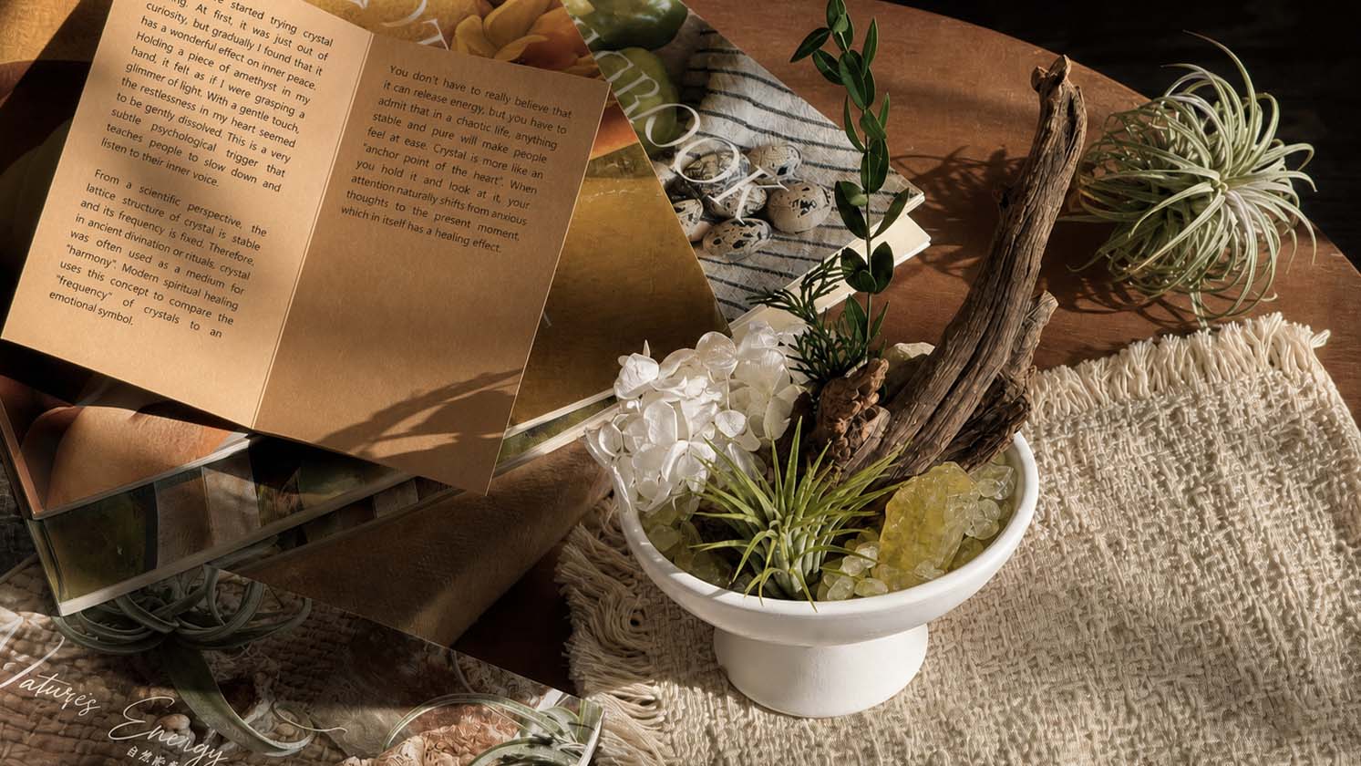 On the brown round table are crystalbooks and crystal landscapes